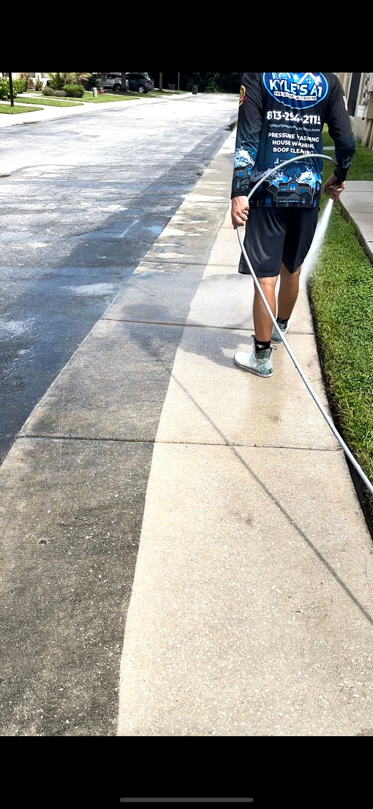 Concrete pressure washing in progress — half cleaned showing dramatic difference